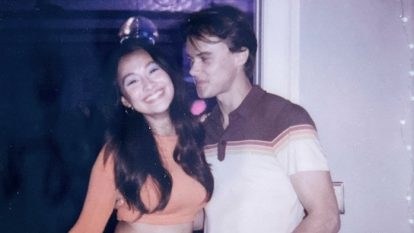 Belly Conklin (Lola Tung) and Conrad Fisher (Chris Briney) pose for a polaroid at their party.