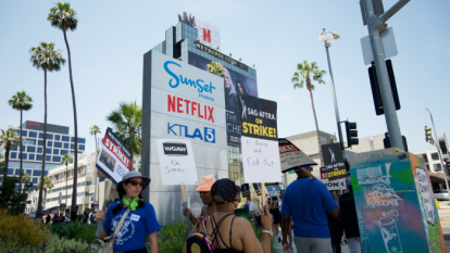 Actors and writes on strike in front of Netflix Studios in Los Angeles