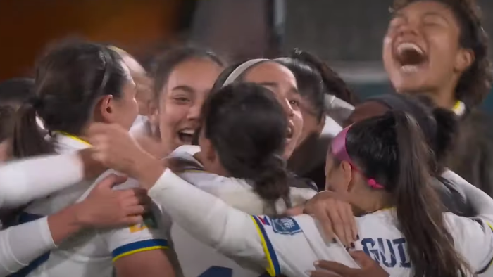 The women's soccer team for the Philippines celebrating their first win.