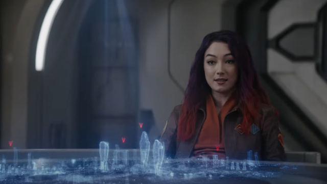 Sabine Wren (Natasha Liu Borzizzo) sits in front of a holographic map.