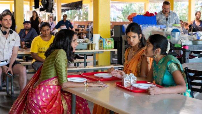 Mindy Kaling on set overseeing a scene with Poorna Jagannathan, Richa Moorjani and Maitreyi Ramakrishnan on the set of "Never Have I Ever."