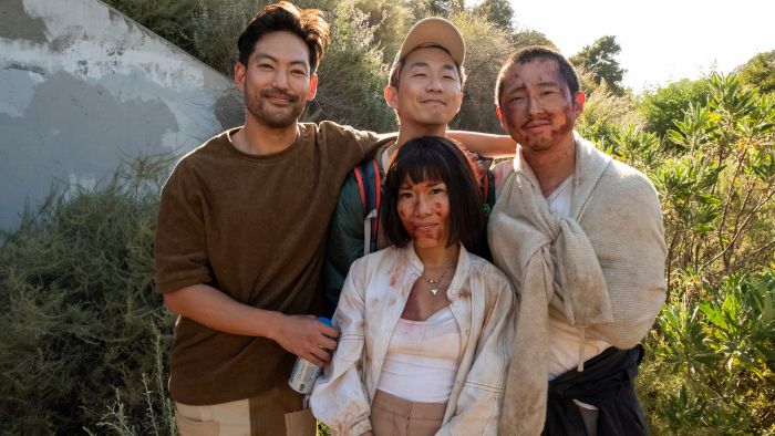 Joseph Lee, Ali Wong, Lee Sung Jin and Steven Yeun share a smile together behind the scenes on the set of "BEEF."