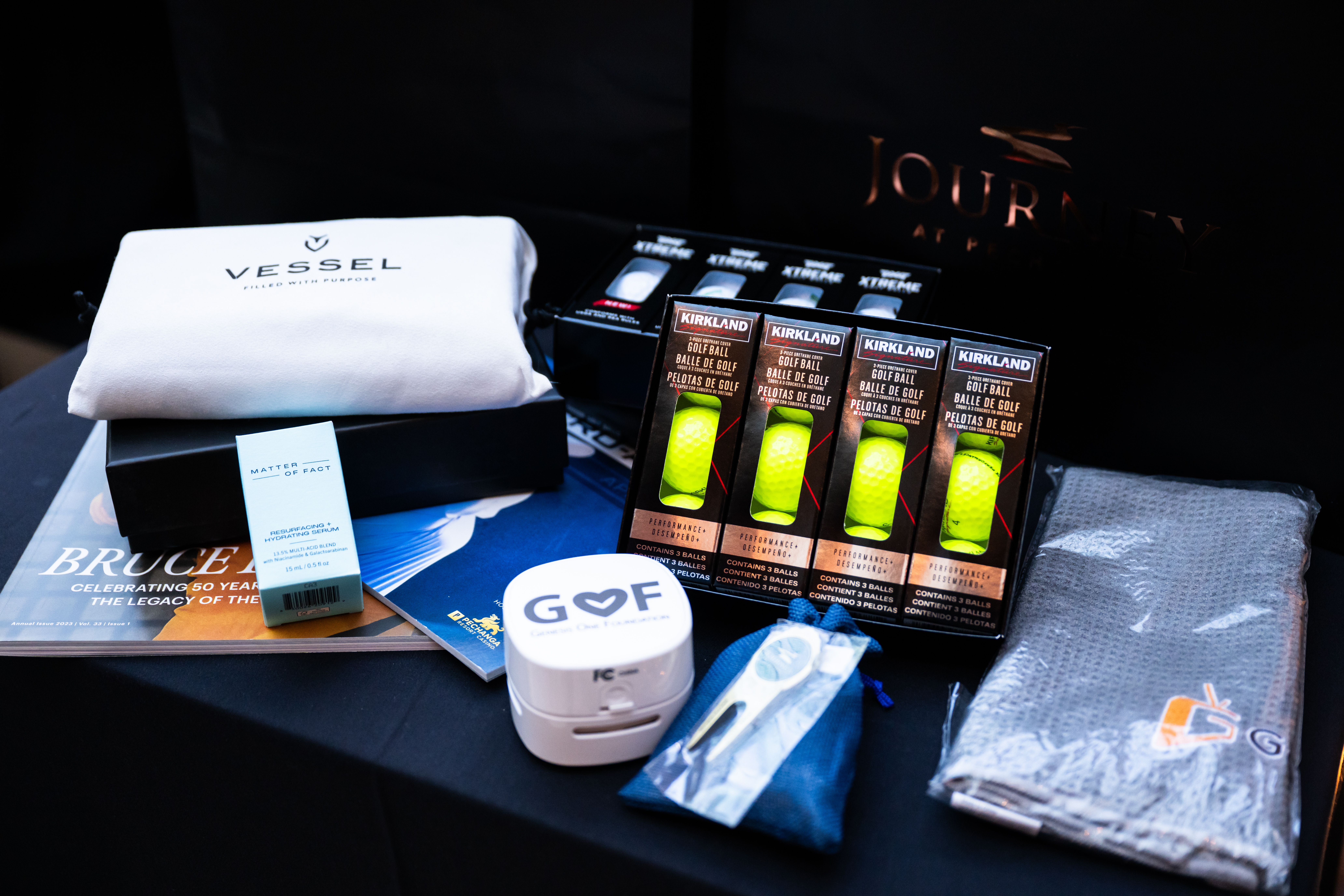Player gift bags stuffed with custom CM tees, Pechanga ball markers and divot fixers, GoldenTV-sponsored Vessel towels, SM Global-sponsored PXG and Kirkland golf balls, Matter of Fact serums, Genesis One Foundation desk vacuums and Pair of Thieves socks.